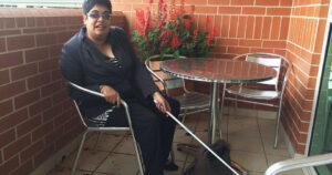 Nidhi Shekaran holding her cane