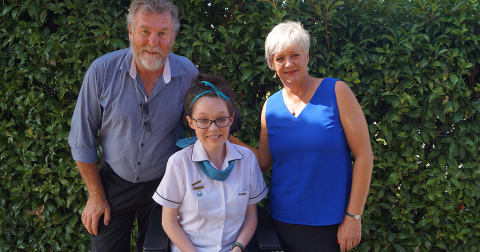 Wheelchair user Sarah Walsh with her parents