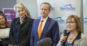 Northcott CEO Kerry Stubbs addresses a morning tea to celebrate the full NDIS roll out as Tanya Plibersek and Bill Shorten watch on