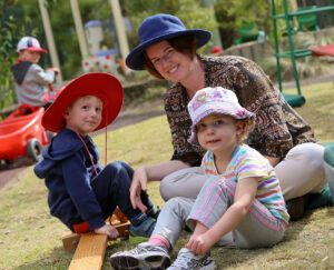 Two children with their preschool teacher