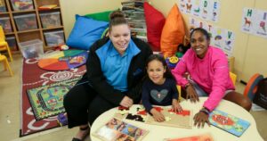 Kelly with her daughter Jameka and a Northcott worker