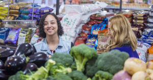 Northcott customer Susu smiling at the camera in a supermarket