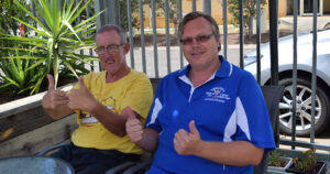 Support Worker Richard and Northcott Customer Duncan smiling with their thumbs up