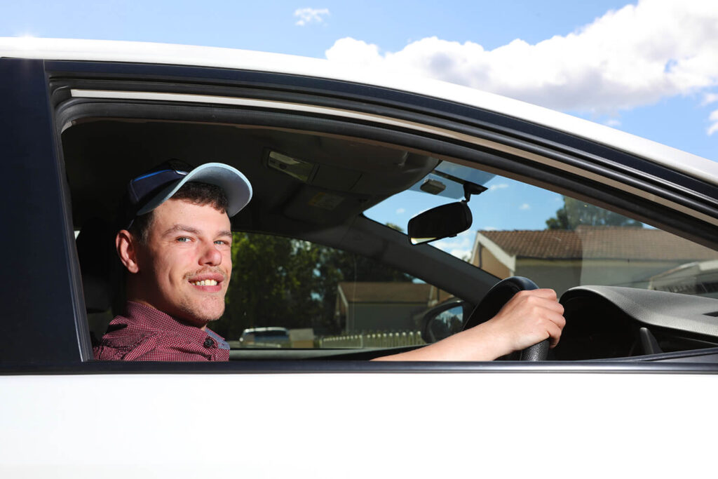 Man sitting in the driver side of the car