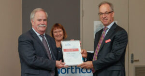 Lee Price receives a certificate from the Northcott board Chairperson.