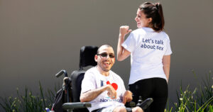 Mo and Alicia from Northcott wearing t-shirts which say 'I love Northcott. Let's talk about sex'.