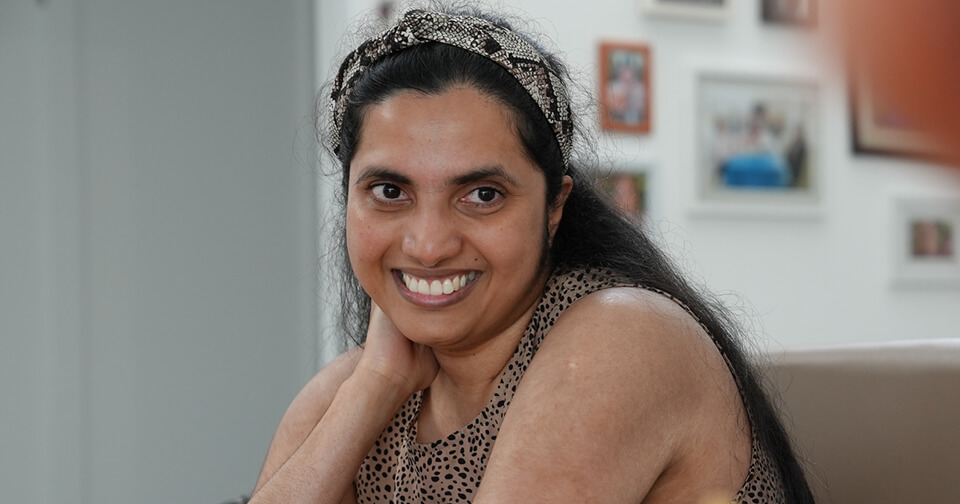 Vindya (Young woman) smiling at camera