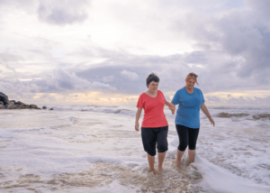 Two women walking on the beach