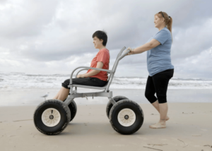 A woman in a beach wheelchair