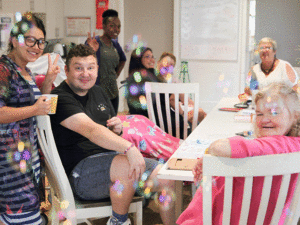 A group of adults socialising with bubbles