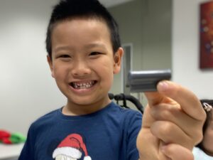 Young boy smiling at the camera