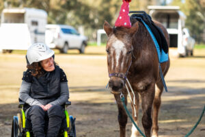 Women looking at a horse