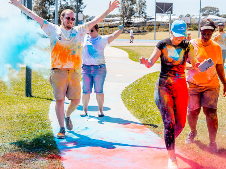 A group of people enjoying the colour run