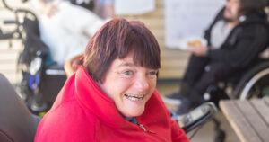Older woman in wheelchair smiling
