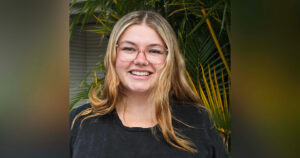 Headshot of young woman wearing glasses