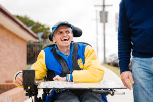 man in wheelchair smiling