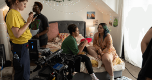 People on set for film making in a bedroom