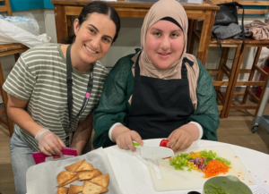 Two females prepping food