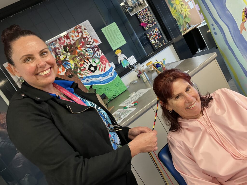 person braiding hair