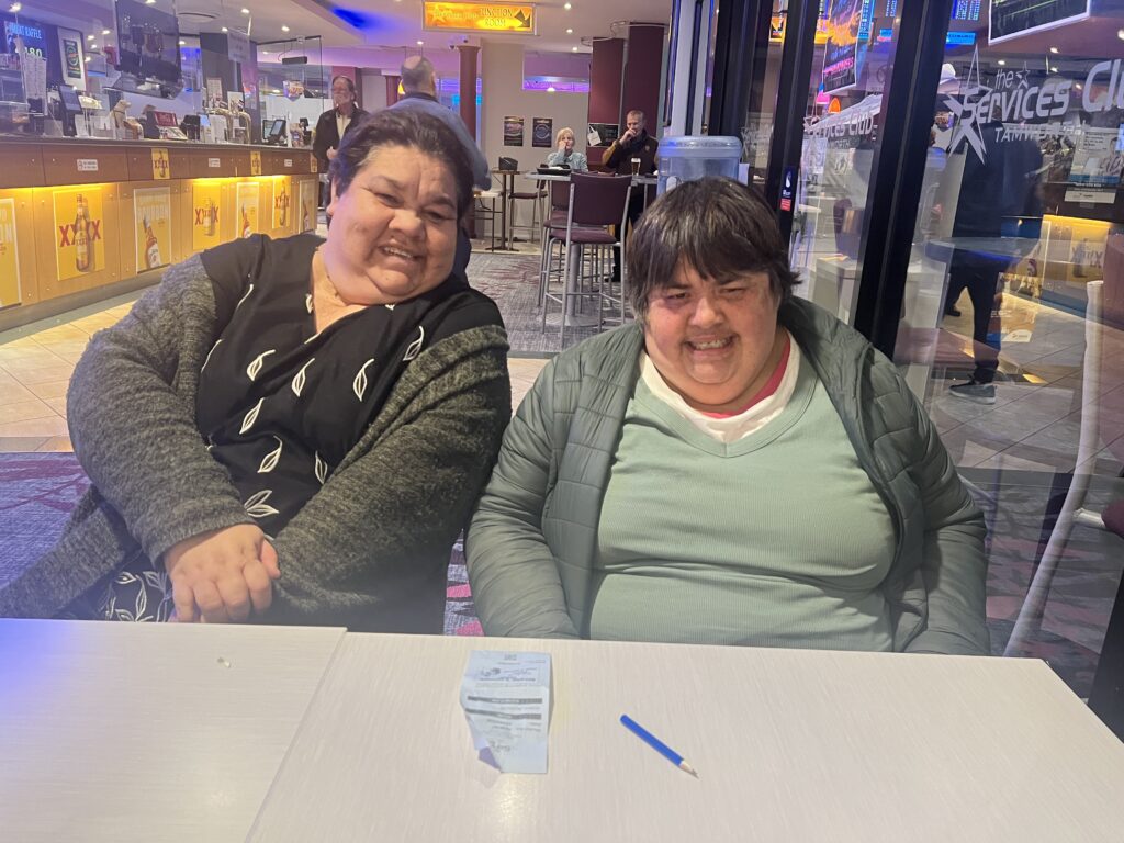 Two women sitting in tavern