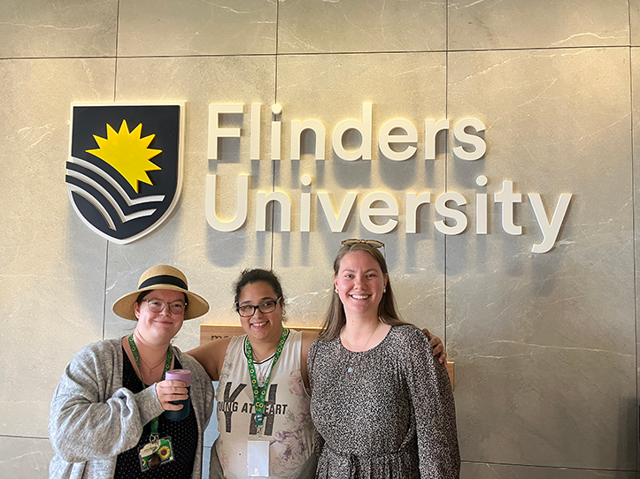 Three women outside Flinders university