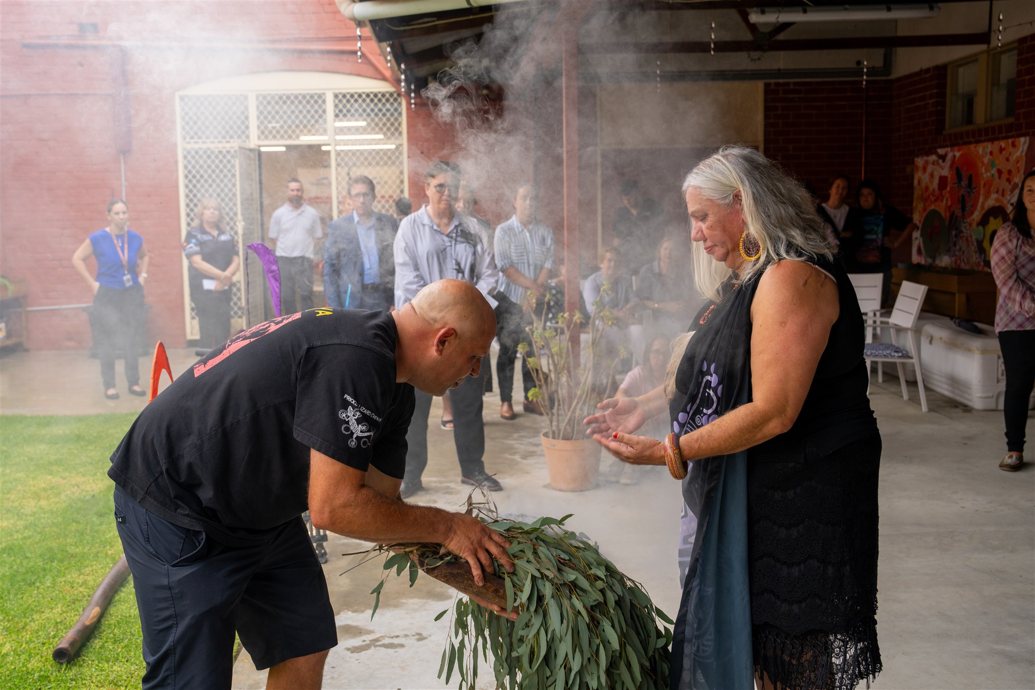 Two people during smoking ceremony.