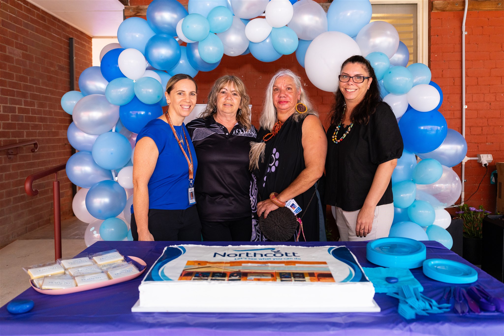 People in front of cake