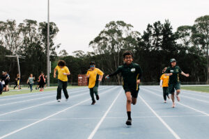 young athletes running toward the camera