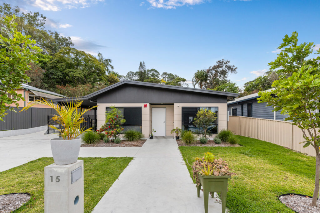 A low set home with a long straight path.